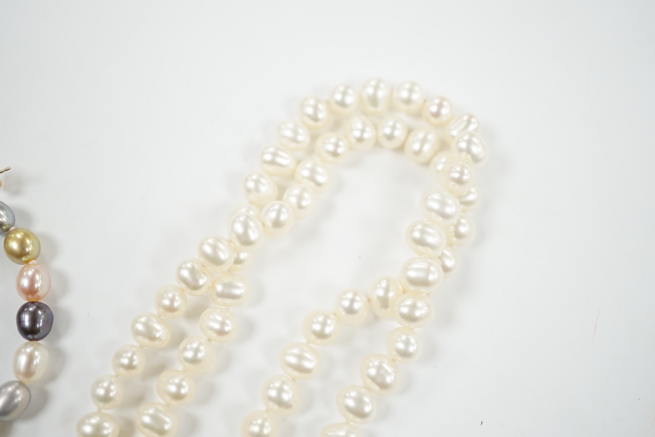 Two freshwater pearl necklaces including double strand, 56cm and a pair of 9ct and multi coloured freshwater pearl earrings.